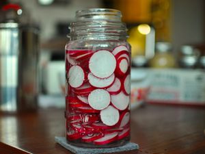 A jar of fermented radish slices.