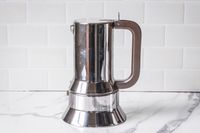 An espresso coffee maker on a kitchen counter