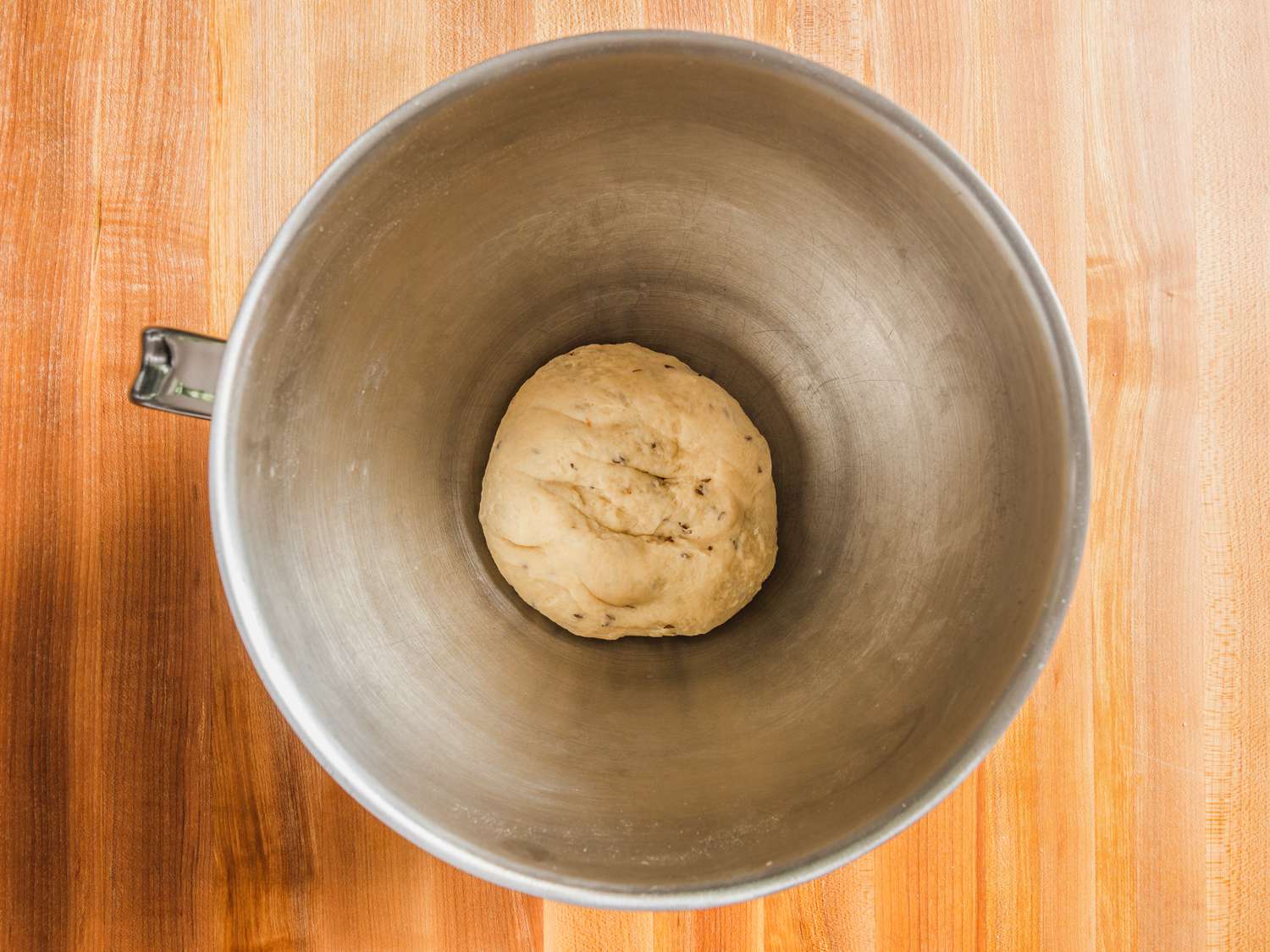 Ball of samosa pastry dough in bottom of stand mixer bowl.