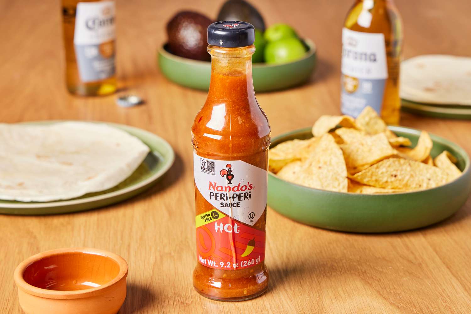 Nando's Extra Extra Hot Peri Peri Sauce (4-Pack) on table