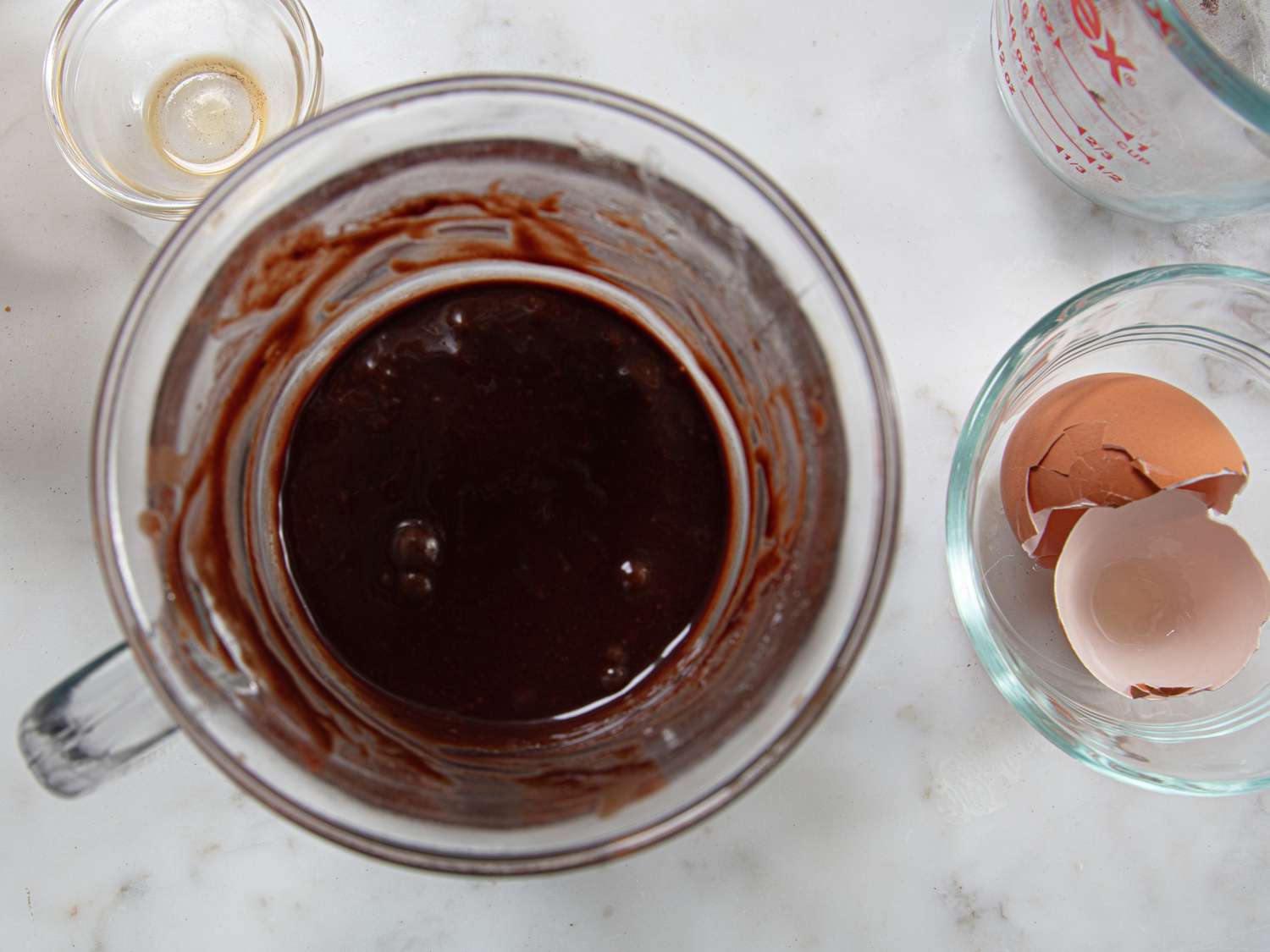 Overhead view of cake batter with egg