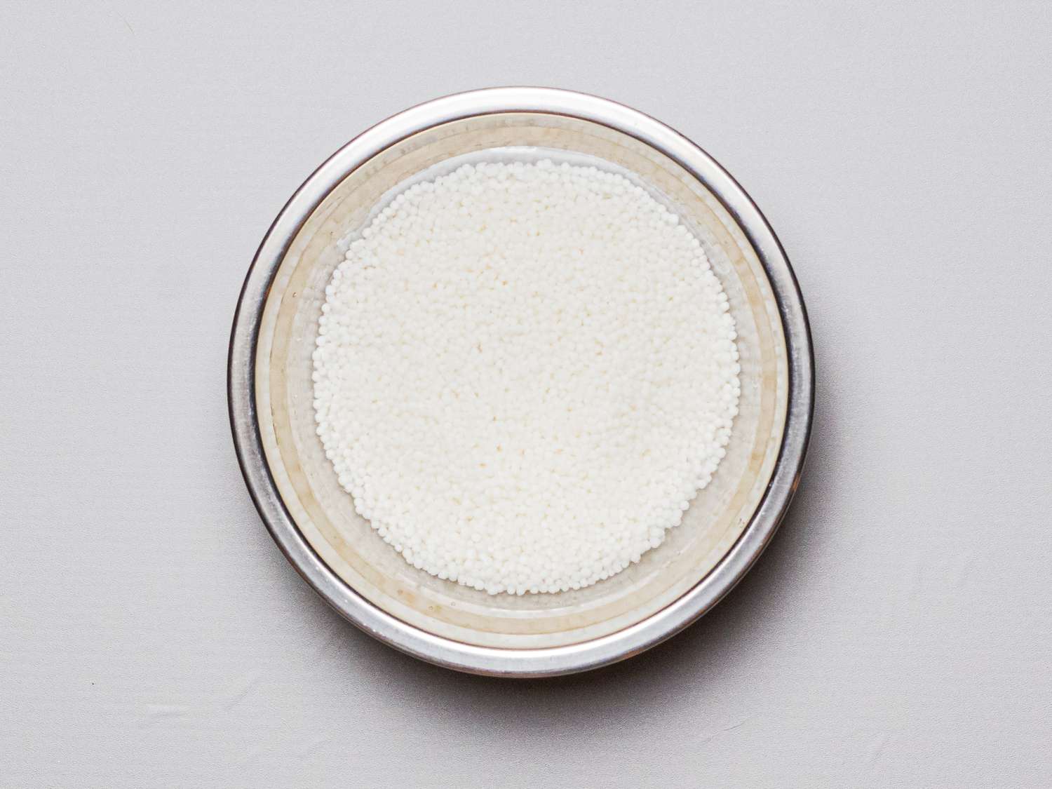 Overhead view of pearls in water