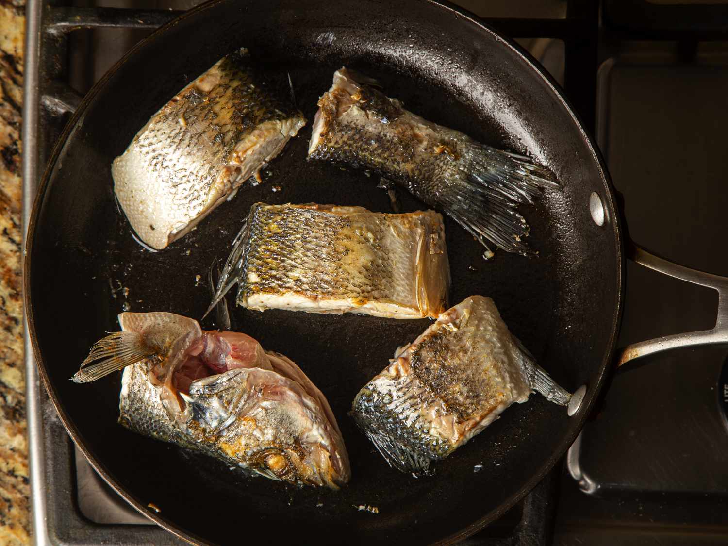 Overhead view of fish in pan