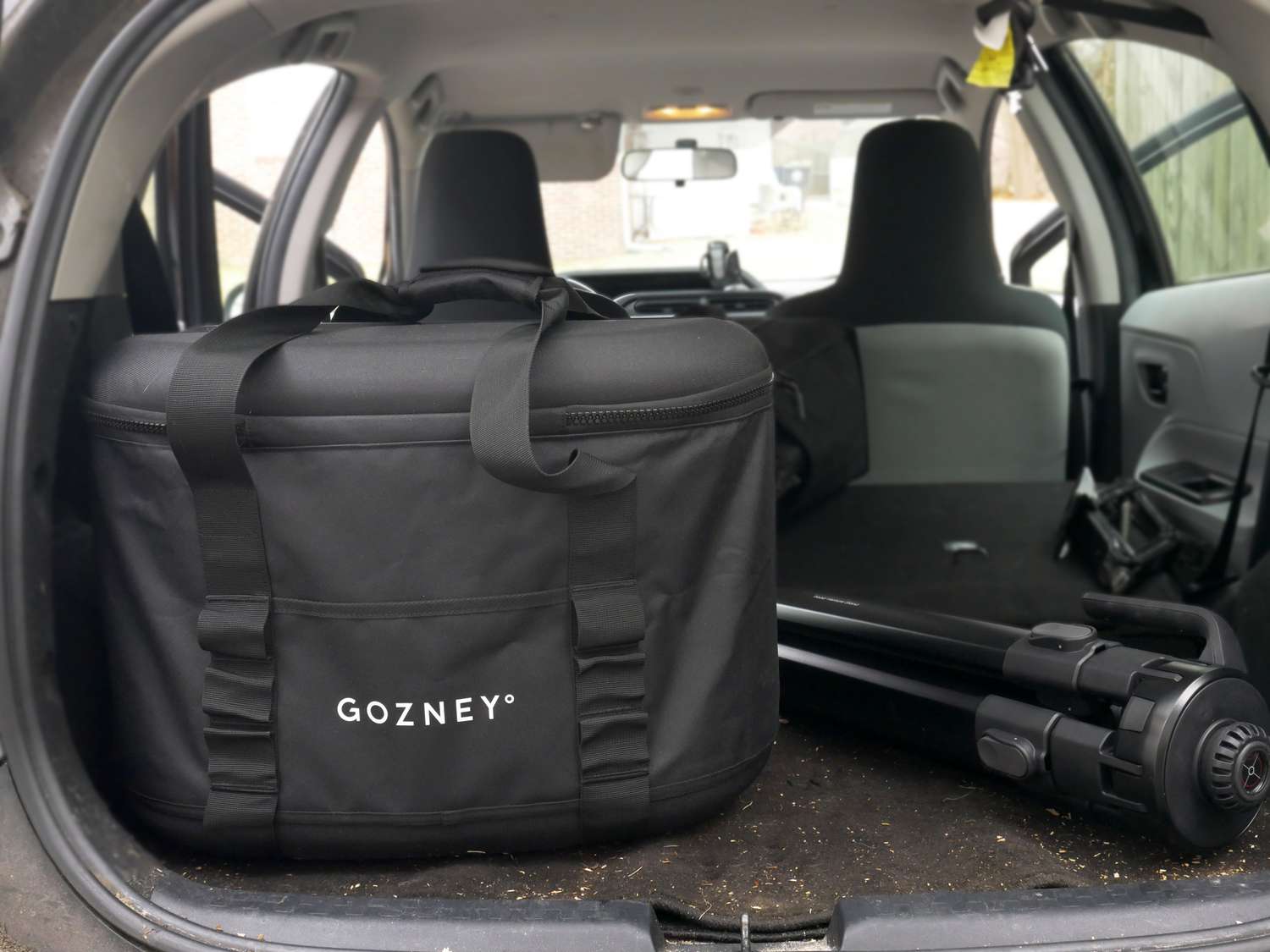 the Gozney tread bag and stand in the back of a car