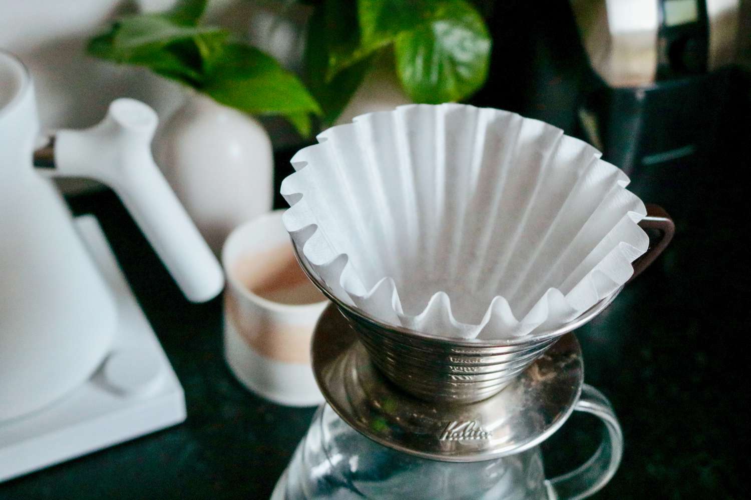 An empty filter sitting in a pourover brewer