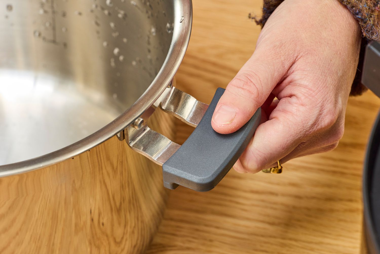 The handle of Instant Pot Pro Plus Wi-Fi Smart 10-in-1 6-Quart Pressure Cooker