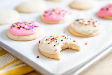 Homemade lofthouse cookies on a baking sheet.
