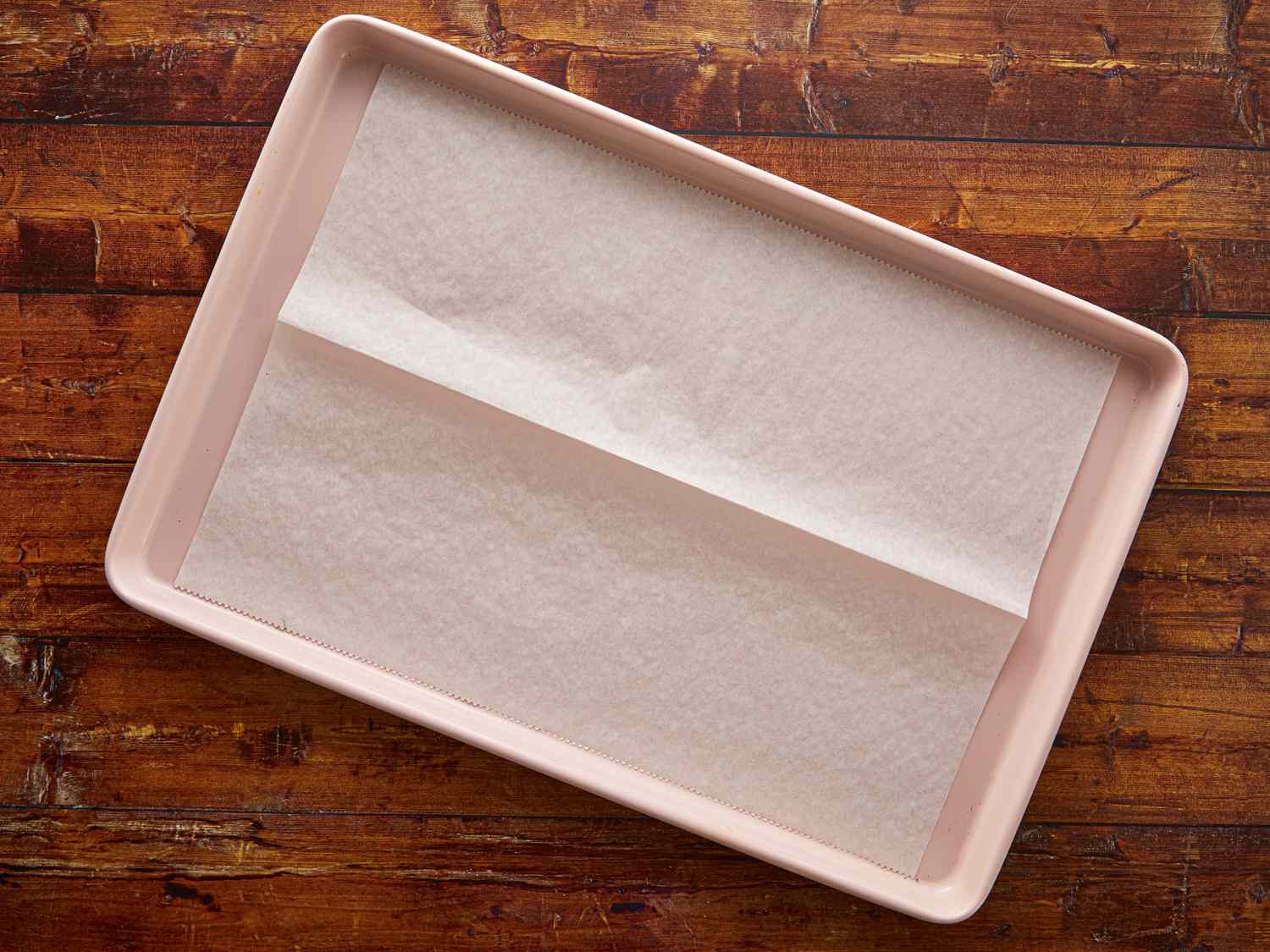 A lined baking tray prepared for use
