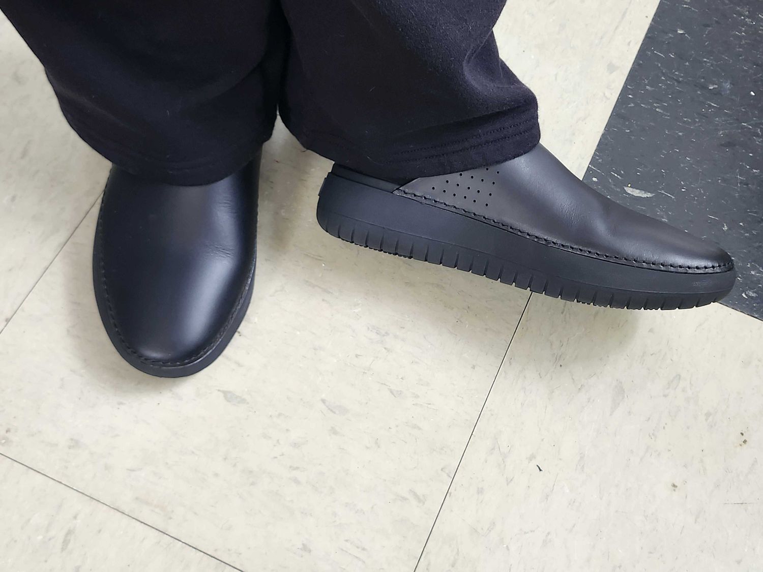 A person wearing the Misen kitchen shoes.