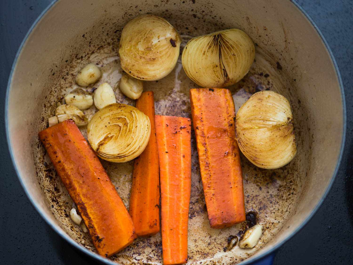 Browning carrots, garlic, and onion for boeuf Bourguignon. 