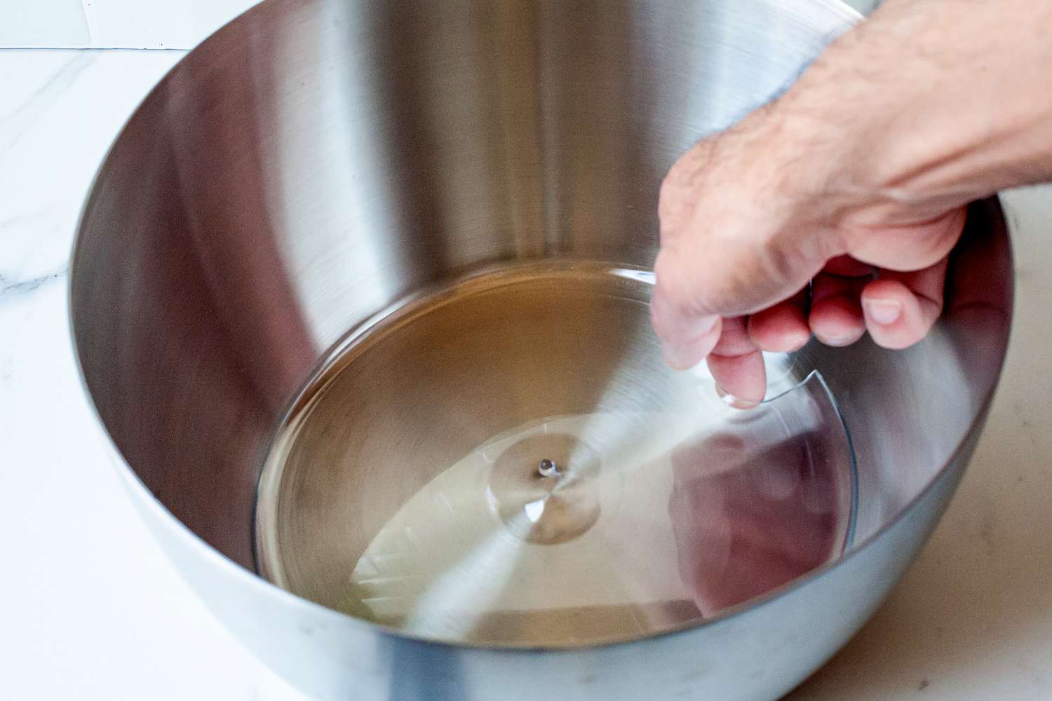 the drain hole in the bottom of the steel bowl