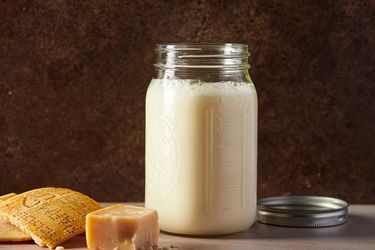 Creamy Parmesan stock in an airtight glass container