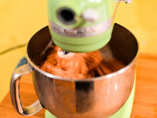 Mixing raw meat in a stand mixer.