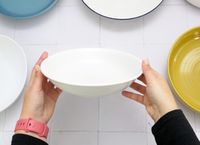 a person showing the side of the hammke bowl