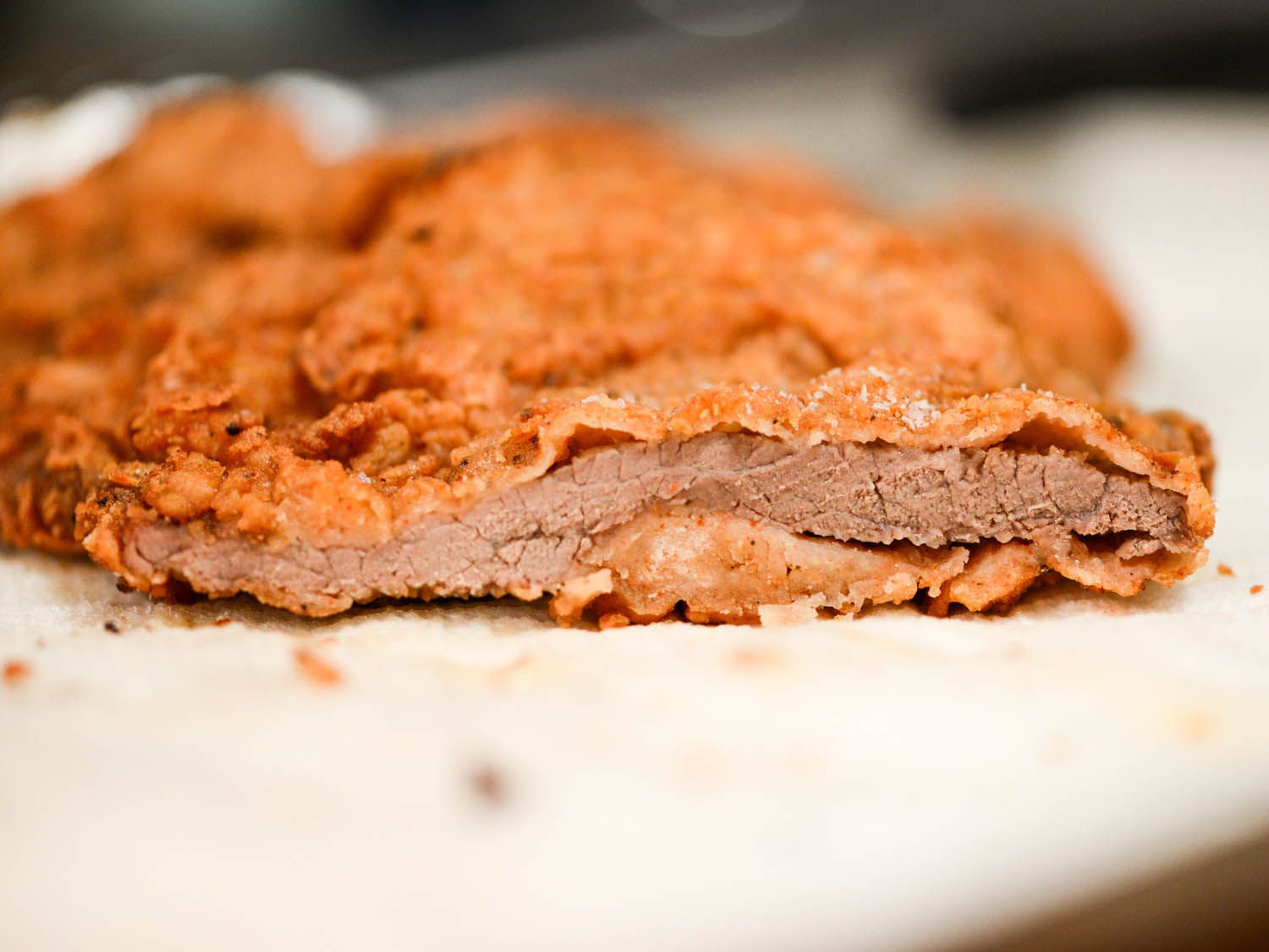 A sliced piece of chicken-fried steak.