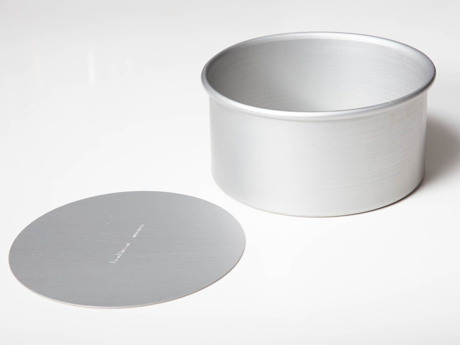 A disassembled loose bottom cheesecake pan.