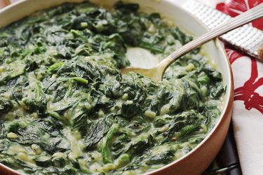 A round serving dish of cauliflower-creamed spinach