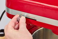 A person adjusts the speed of the KitchenAid 7 Quart Bowl Lift Stand Mixer