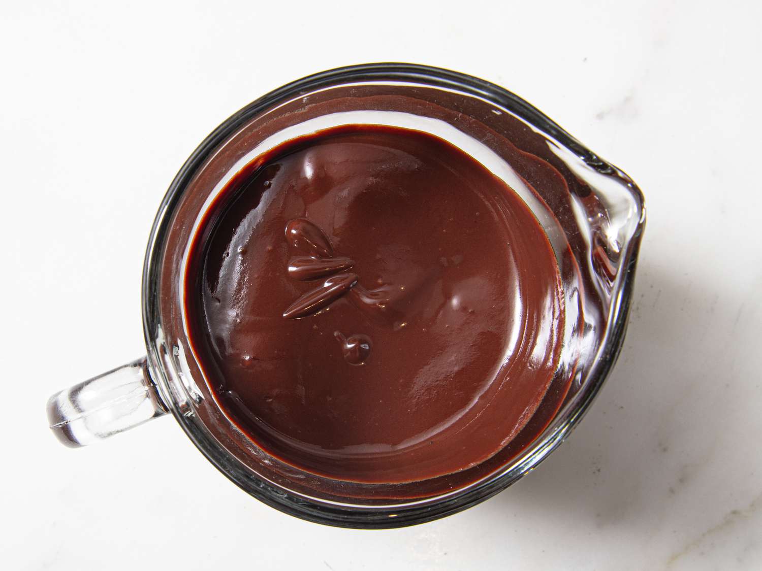 Overhead view of chocolate in measuring cup