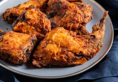 Buttermilk fried rabbit pieces on a serving plate