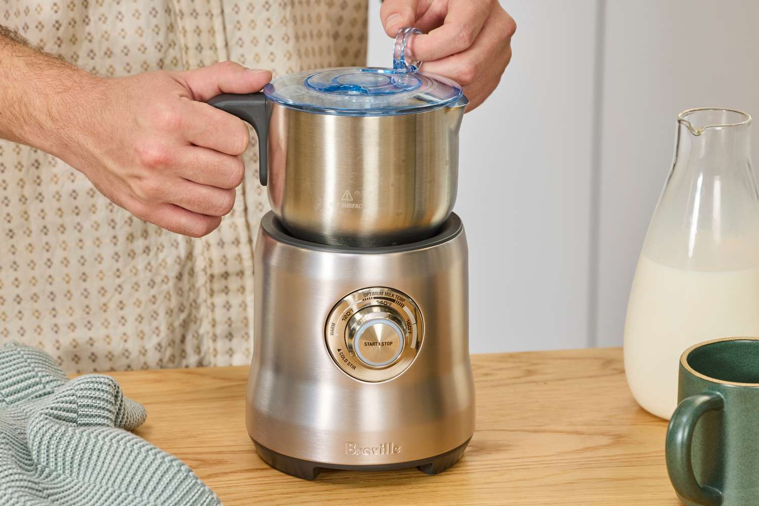 The Breville milk frother on a kitchen countertop.