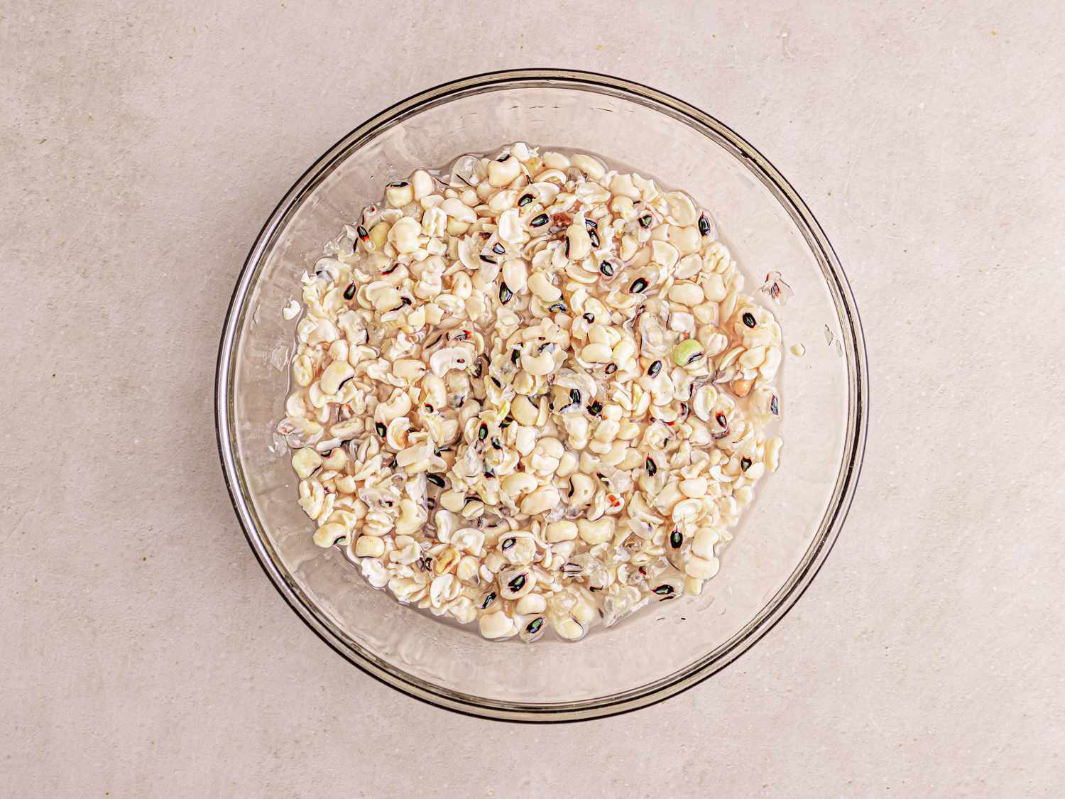 Overhead view of peas with skins mostly removed