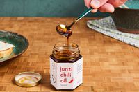 Junzi Original Chili Oil being scooped