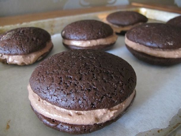 A baking sheet of double chocolate whoopie pies.