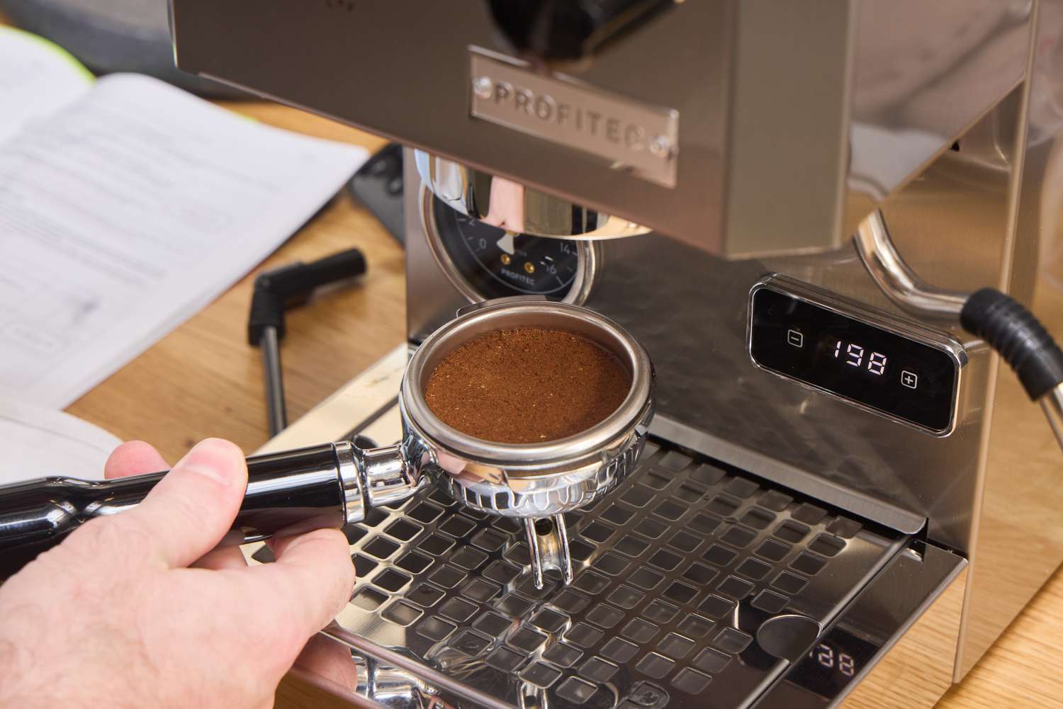 Coffee grounds are inserted into the Profitec GO Single Boiler Espresso Machine