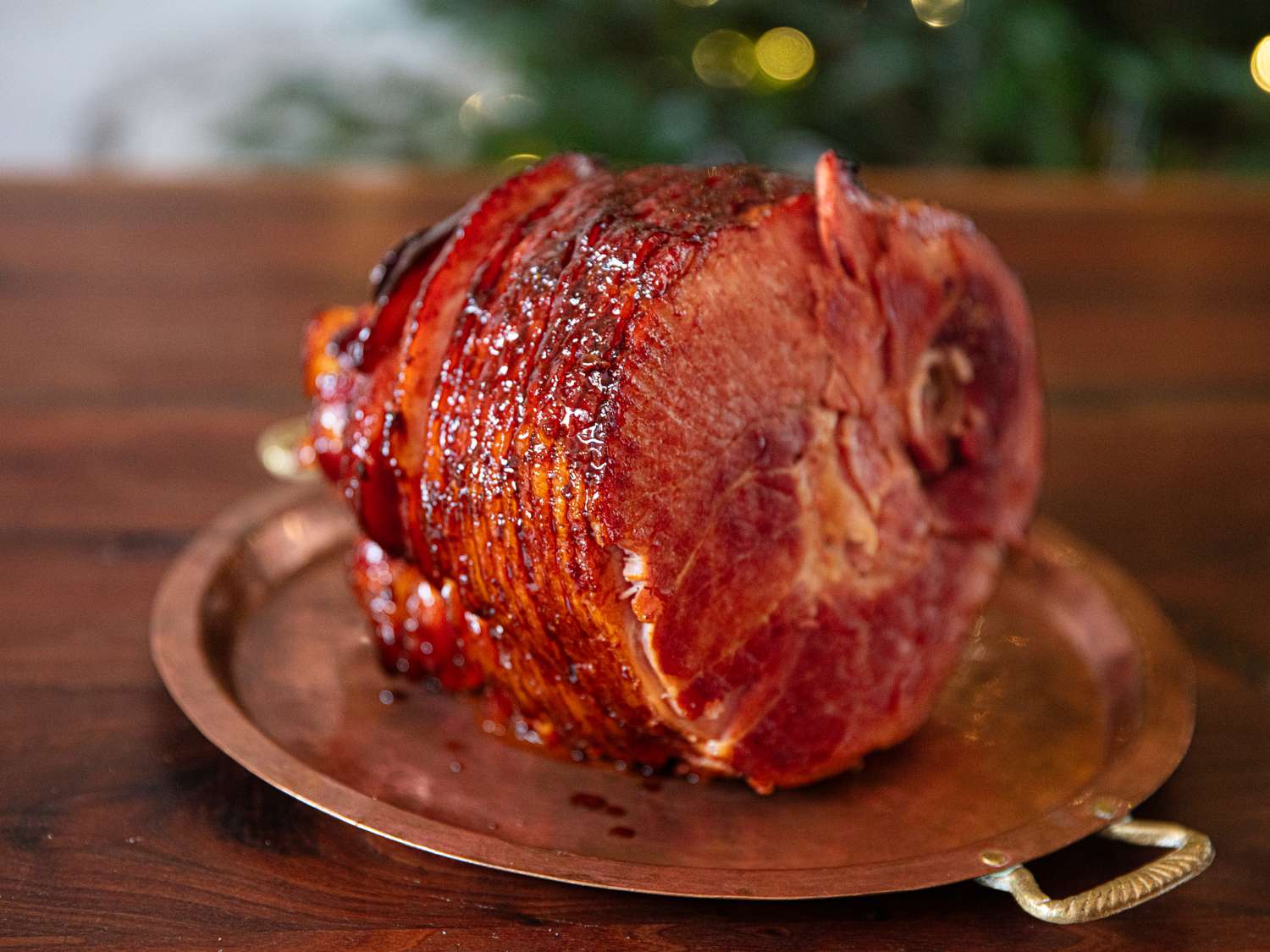 A glazed ham on a platter ready to serve