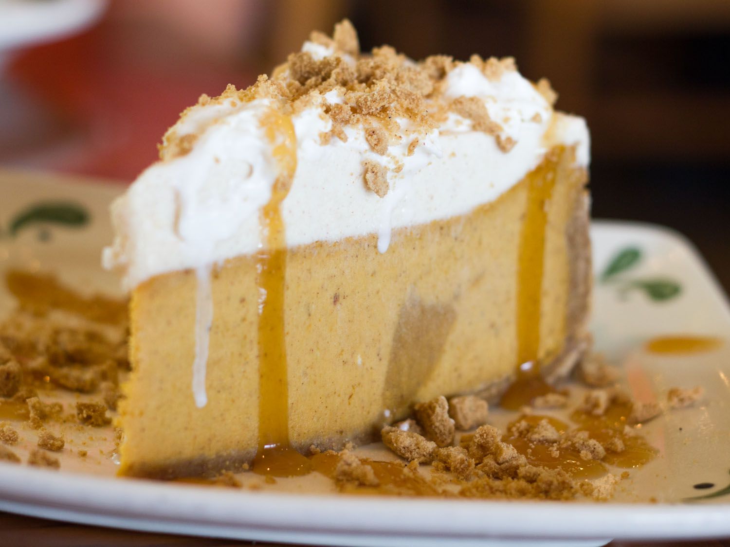 A slice of Pumpkin Cheesecake on a plate