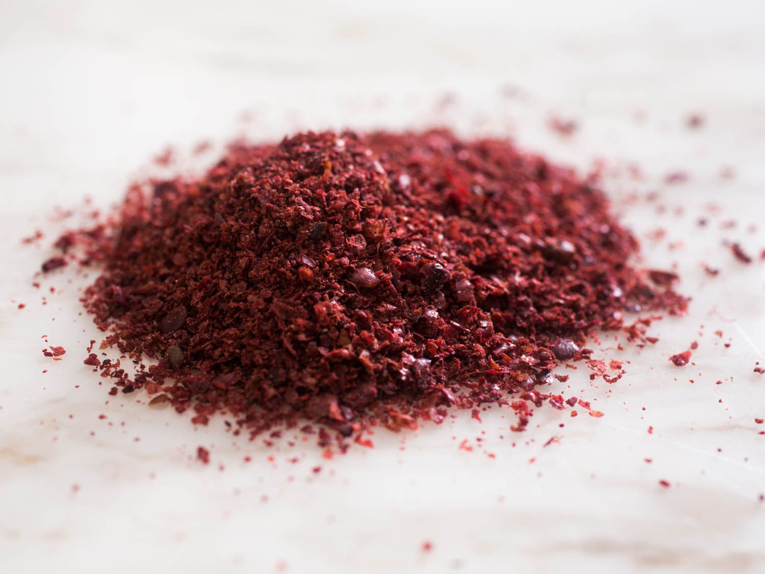A pile of sumac on a countertop. 