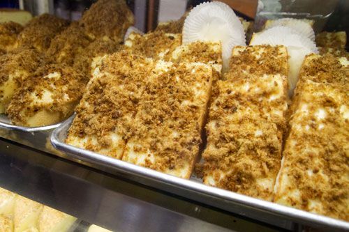 Baking sheets holding slices of pork floss cake