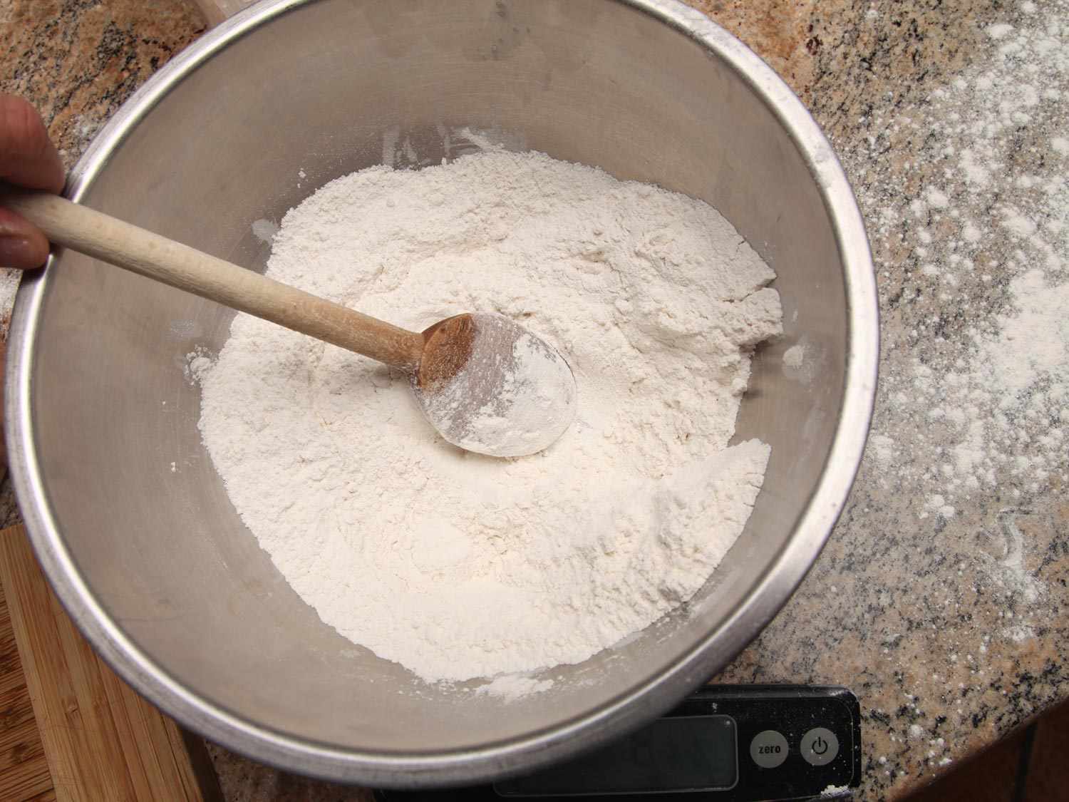 A mixing bowl filled with self-rising flour for biscuits.