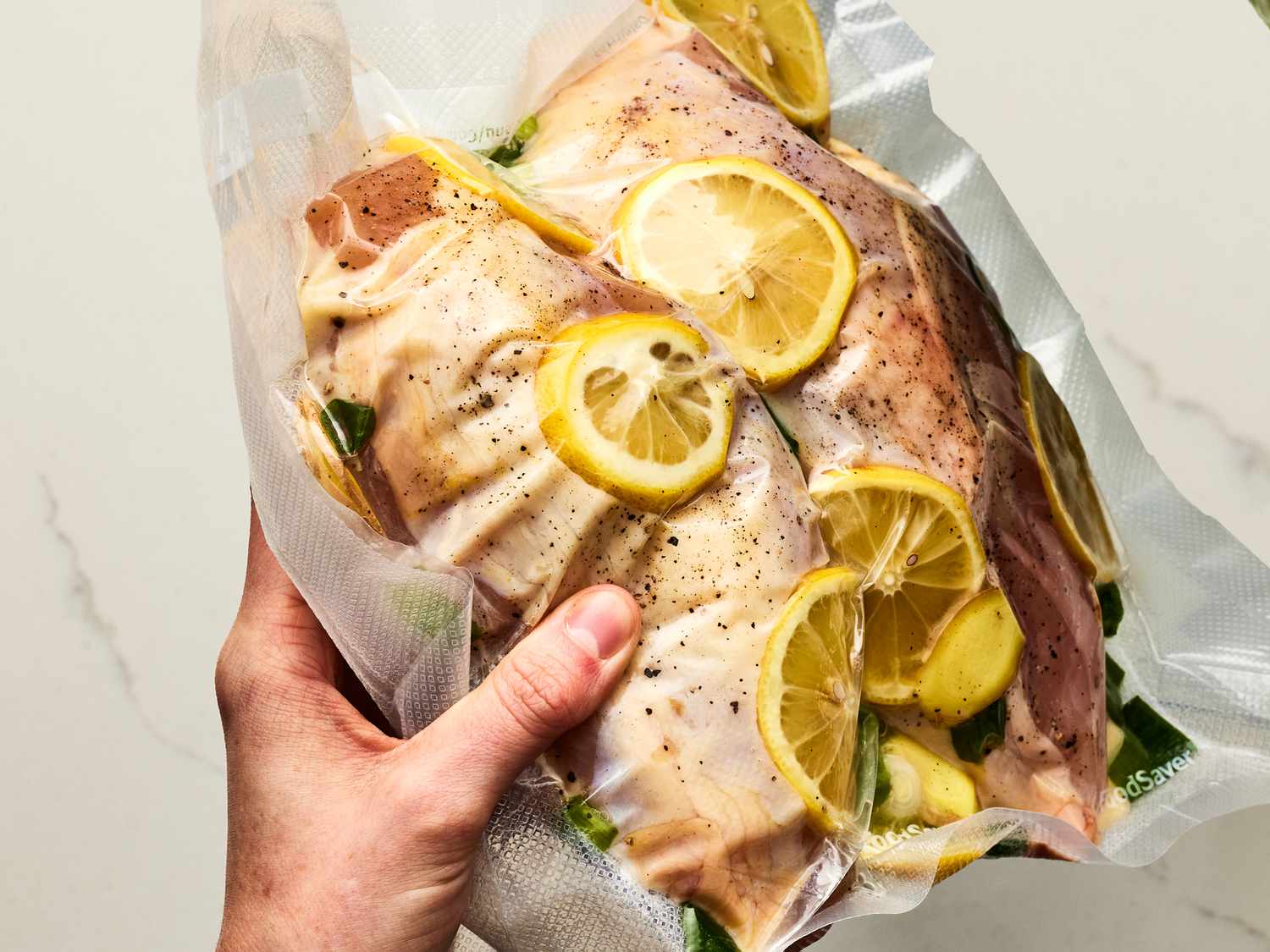 Overhead view of chicken in a vacuum sealed bag 