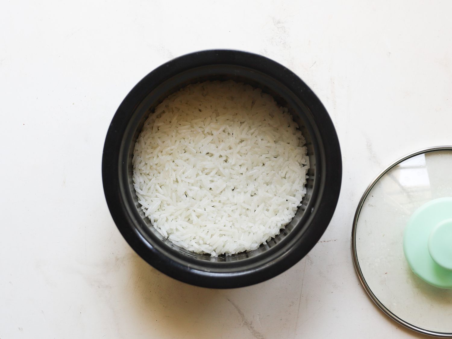 White rice cooking in the Dash mini rice cooker