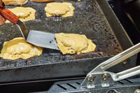 Cheeseburgers cooked on the Weber Slate 30 Inch Griddle