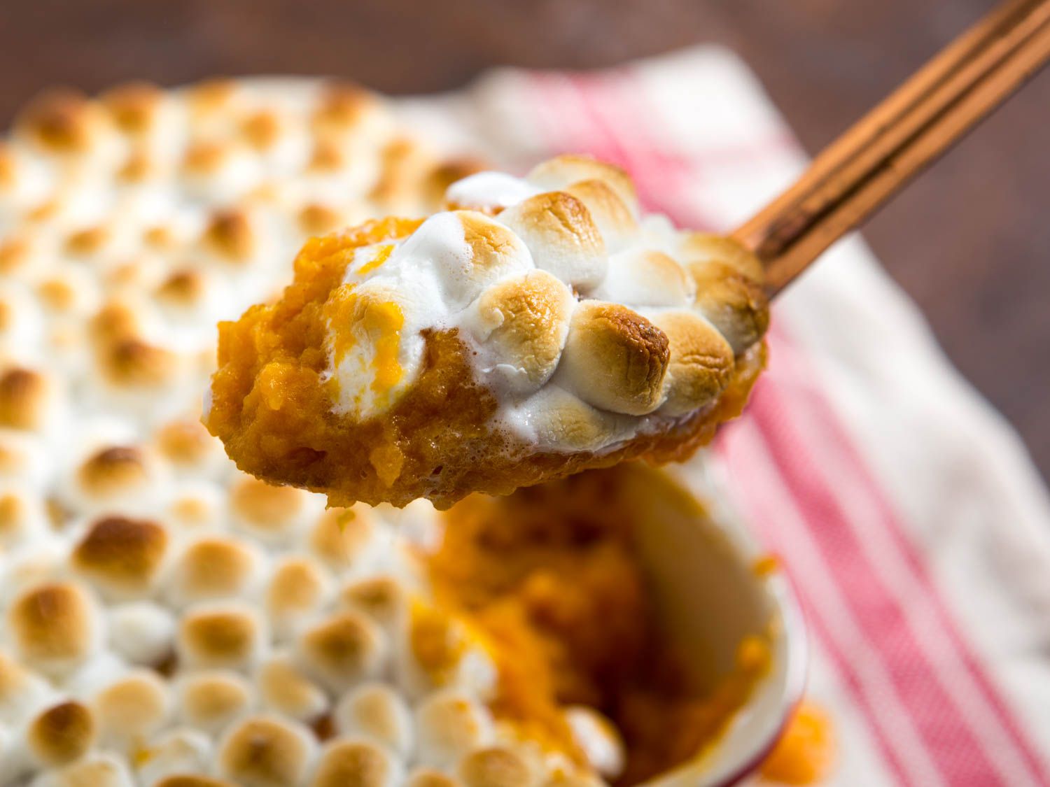 Close-up of sweet potato casserole topped with toasted mini marshmallows