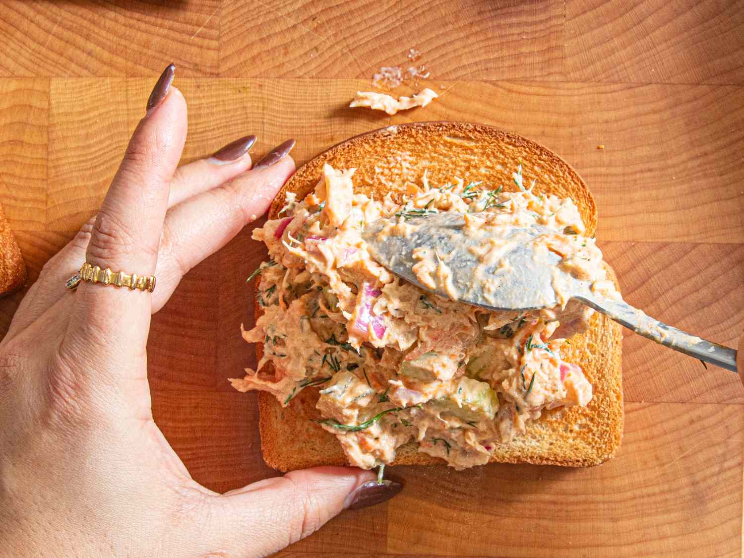 Overhead view of spooning onto toast