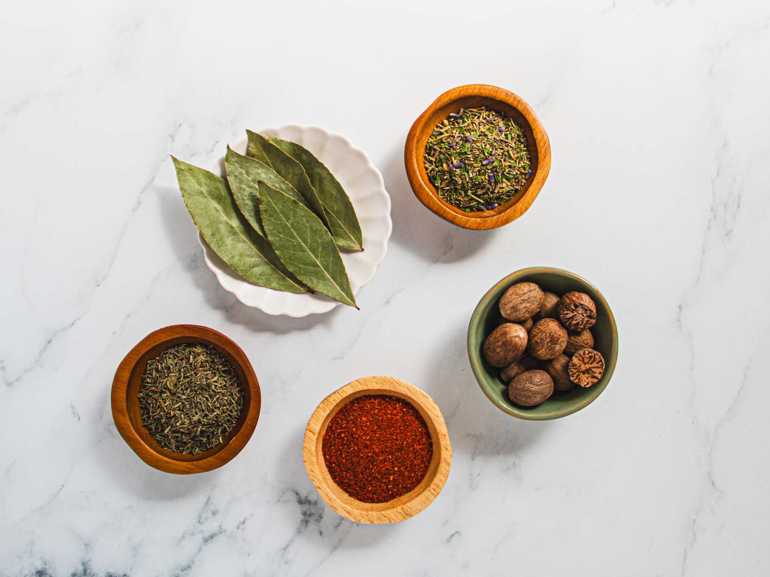 Overhead view of herbs in small bowls