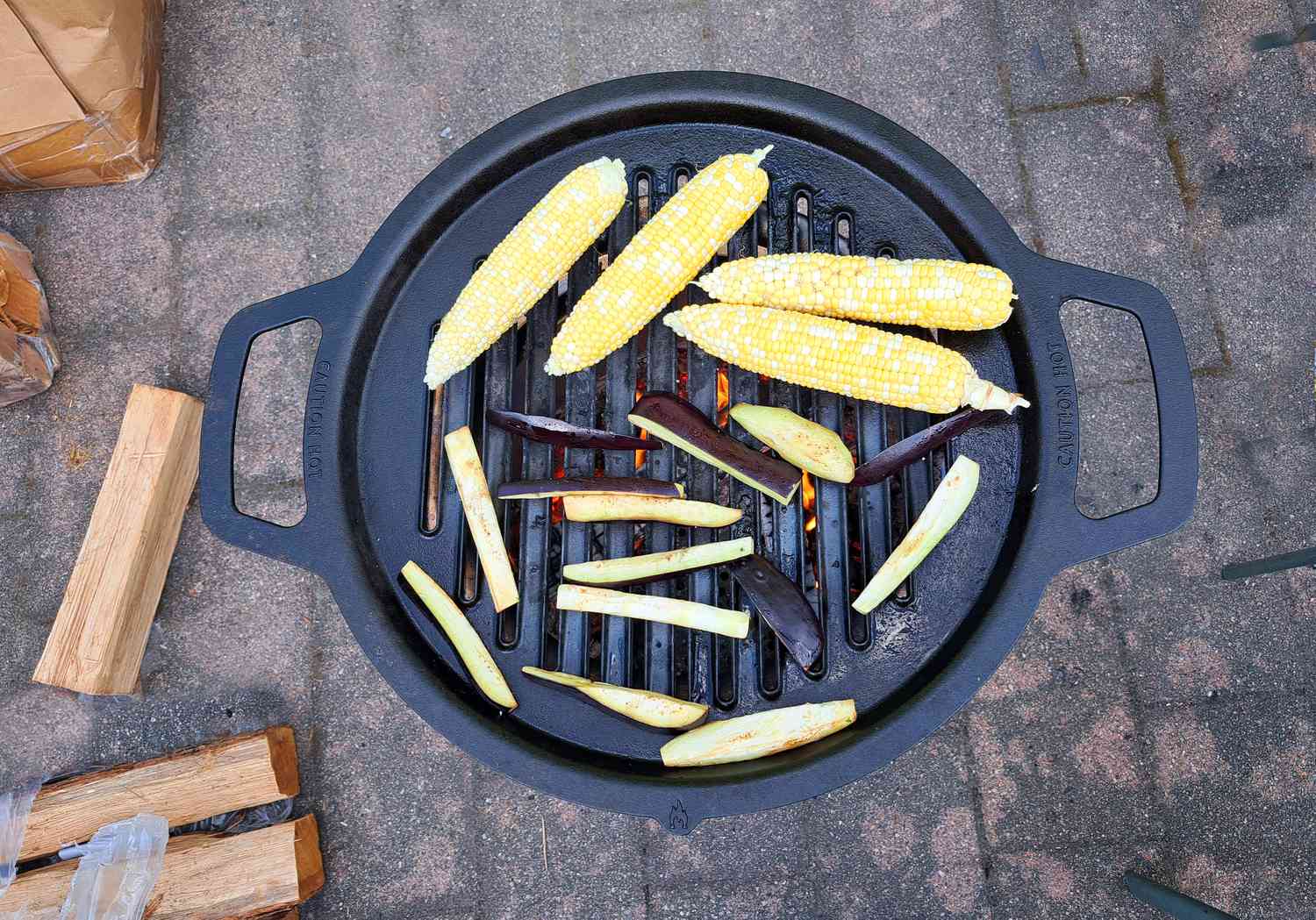 corn and eggplant cooking on the solo stove grill grate