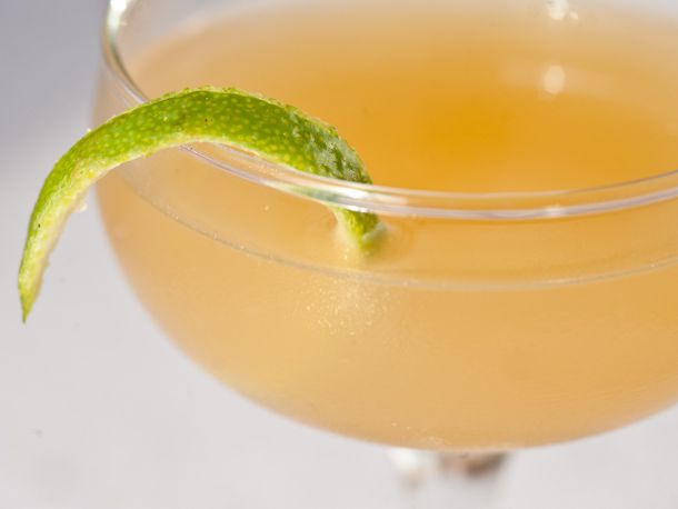 Southern Baptist, a ginger-based cocktail in a coupe with a twist of lime peel. 