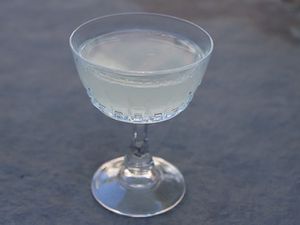 A corpse reviver #2 cocktail in a coupe. 
