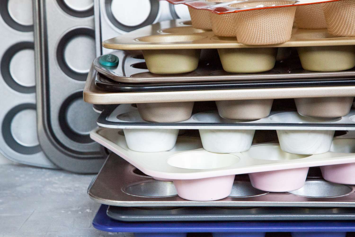 a stack of muffins tins