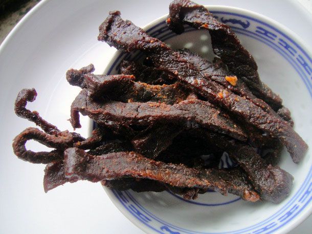 A bowl of homemade beef jerky. 