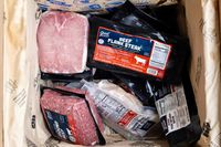 Various Good Chop meats including beef and pork products in a box