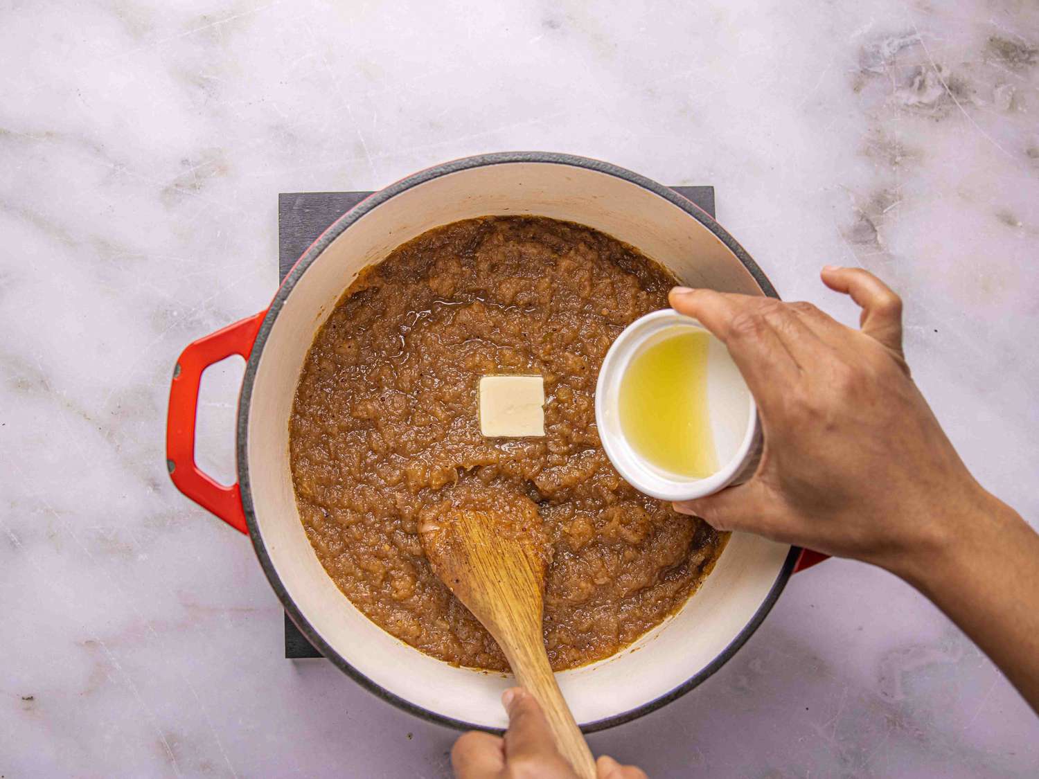 Overhead view of adding butter and lemon