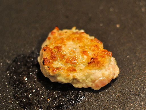 A test portion of the sausage is cooked in a skillet to check seasonings.