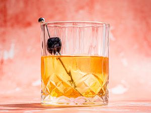 Old Fashioned shot from a low angle on a pink background