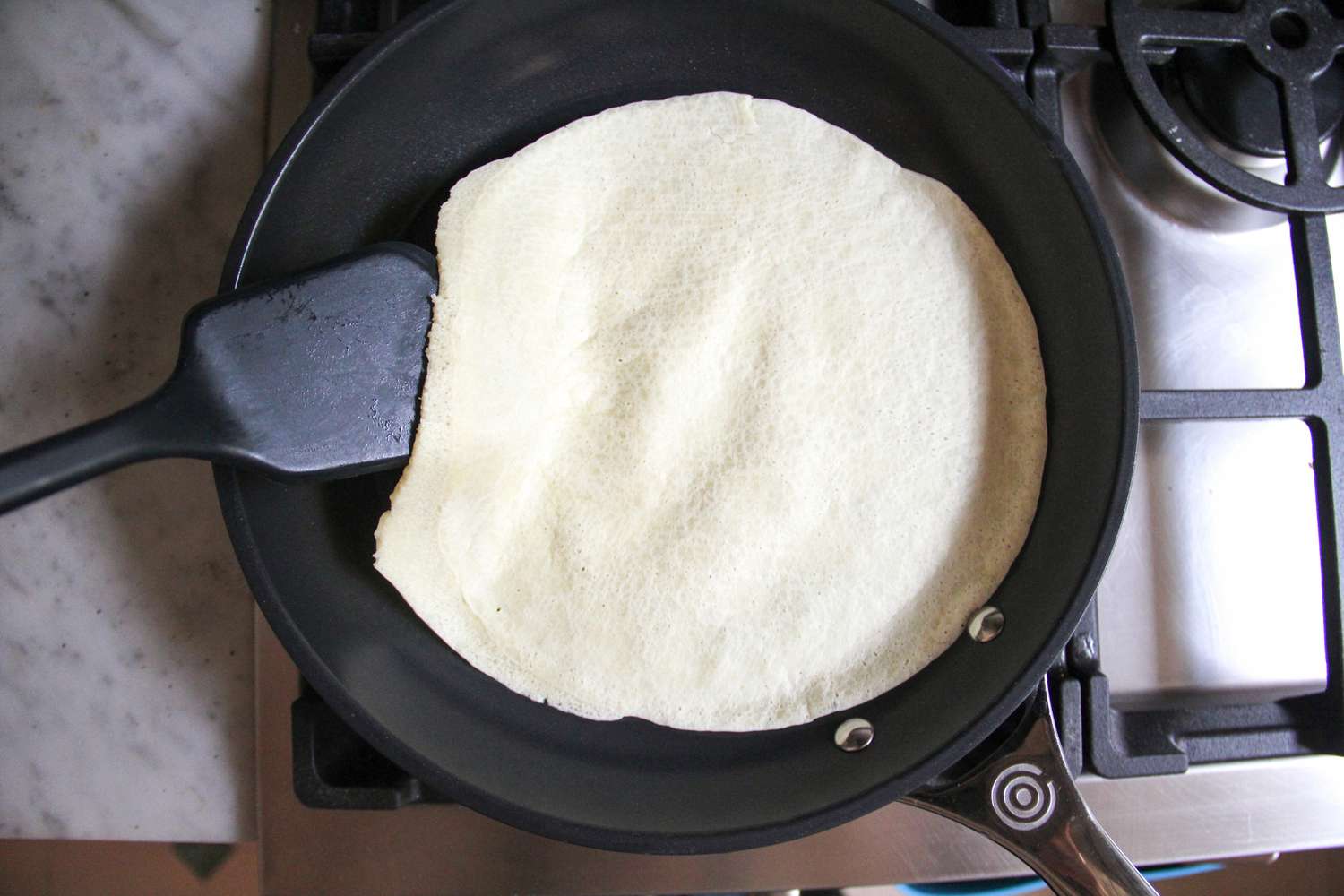 Food cooking in the Le Creuset Ceramic Nonstick Frying Pan